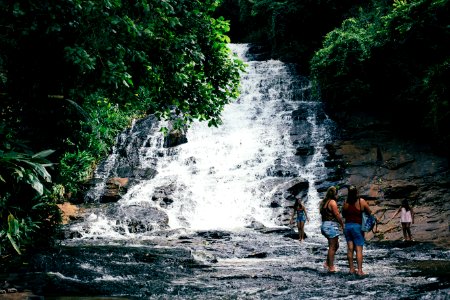 Travelers At Waterfall