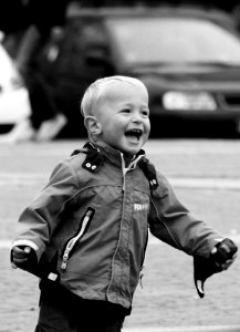 Boy Wearing Jacket On Street In Grayscale Photography photo