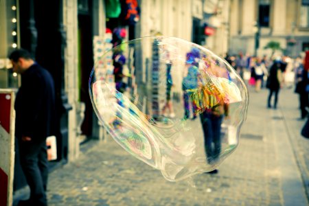 Closeup Of Soap Bubble In City photo