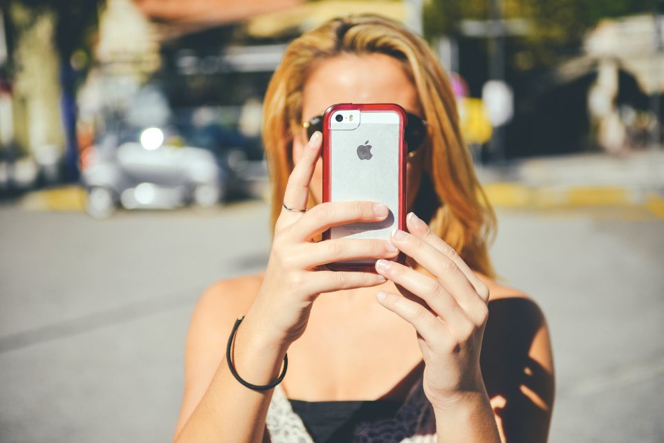 Woman Using IPhone Camera