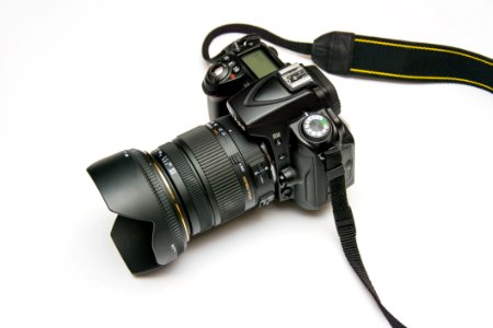 Black Dslr Camera On White Surface photo