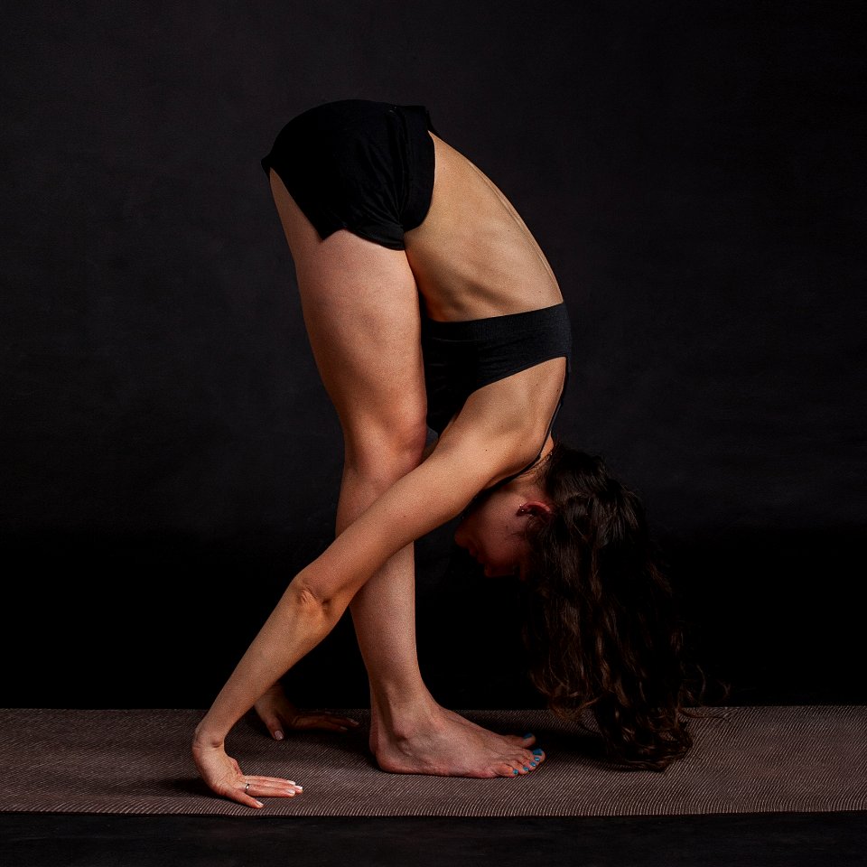 Studio Portrait Of Woman Exercising