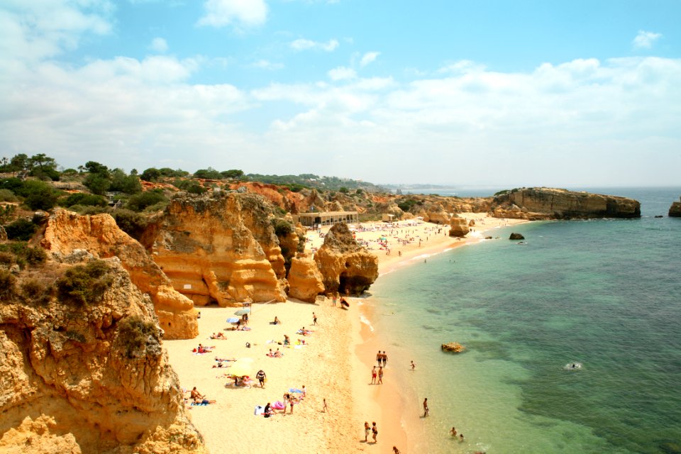 Tourists On Sandy Beach