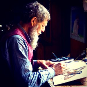 Man Painting Wearing Blue Dress Shirts photo