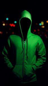 Faceless Person In Green Hoodie