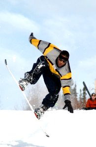 Man Riding A White Snowboard During Daytime photo