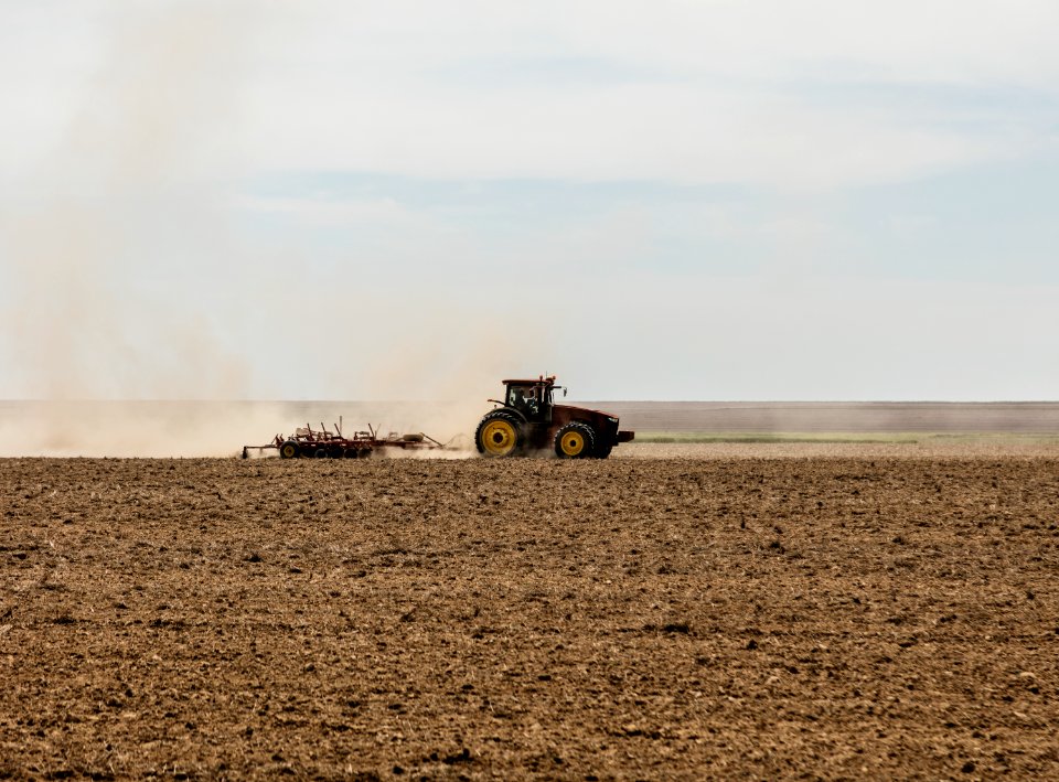 A farmer kicks up dust as he readies the ground for planting near Bristol in Prowers County, Colorado. Original image from Carol M. Highsmith’s America, Library of Congress collection.