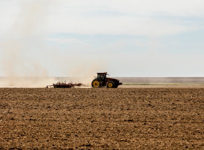 A farmer kicks up dust as he readies the ground for planting near Bristol in Prowers County, Colorado. Original image from Carol M. Highsmith’s America, Library of Congress collection.