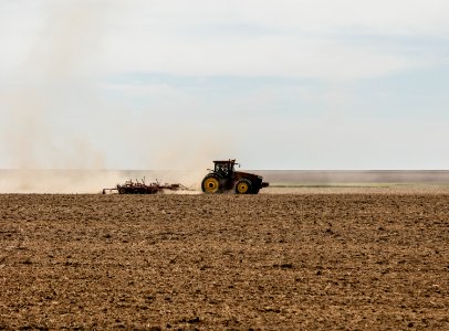 A farmer kicks up dust as he readies the ground for planting near Bristol in Prowers County, Colorado. Original image from Carol M. Highsmith’s America, Library of Congress collection. photo