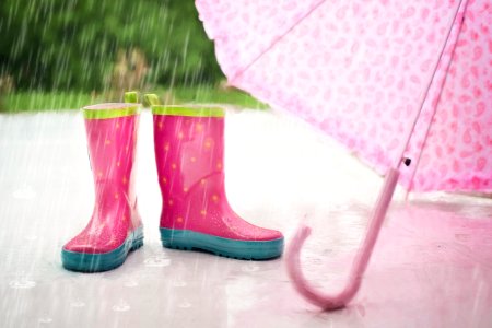 Red And Gray Rain Boots Near Pink Umbrella