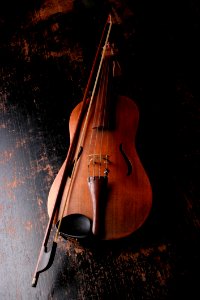 Brown Wooden Violin And Violin Bow photo