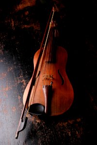 Brown Wooden Violin And Violin Bow