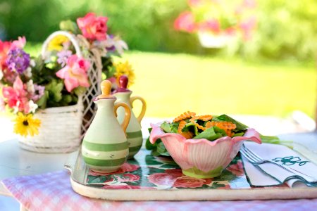 Biscuits On White Ceramic Bowl Beside White Ceramic Container On Silver And White Tray photo