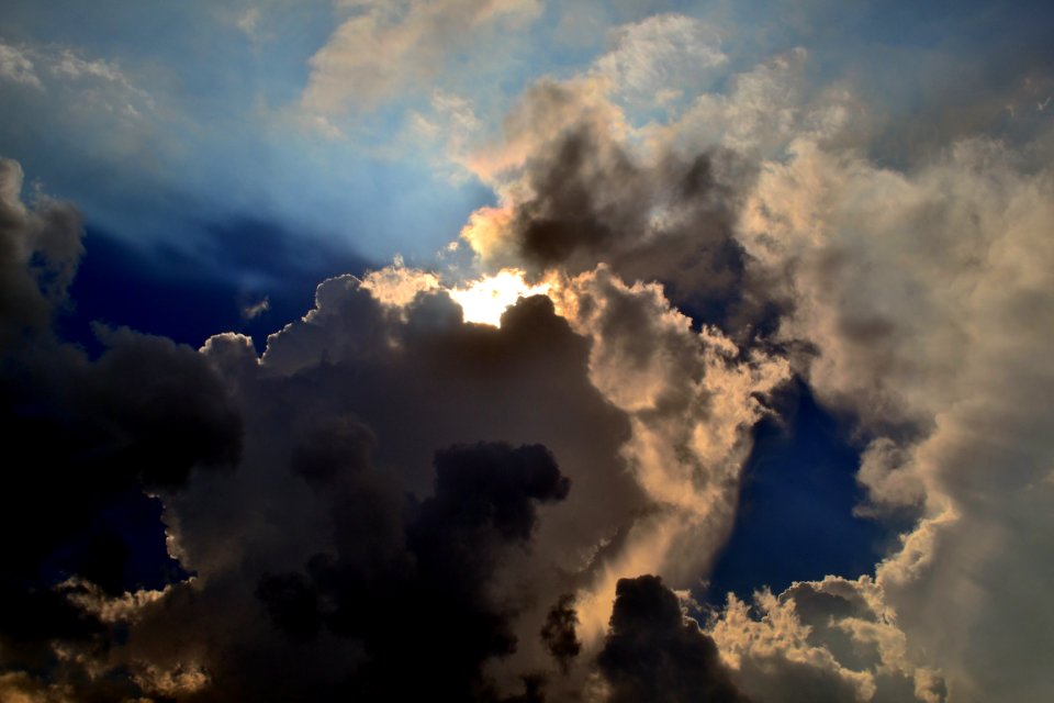 Gray Clouds Cover Sun Under Blue Sky