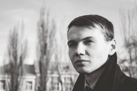 Close-up Of Young Man Against Sky photo