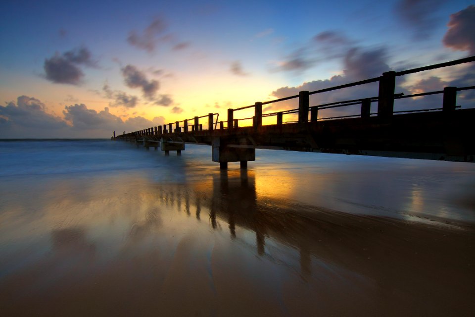 Scenic View Of Sea Against Sky At Sunset