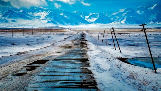 Scenic View Of Snow Covered Mountains Against Sky photo