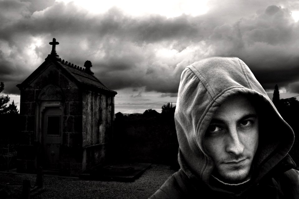 Man In Hoodie In Cemetery