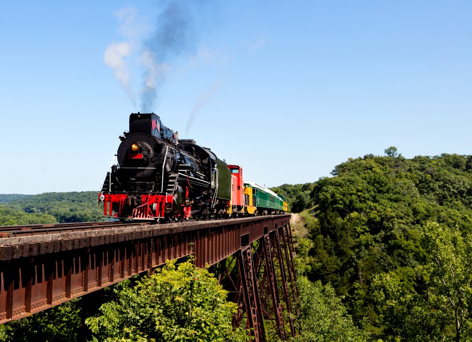 A steam train on a heritage railroad that operates excursions in Boone County, Iowa, crosses the 156-foot-tall Bass Point Creek Bridge. Original image from Carol M. Highsmith’s America, Library of Congress collection.