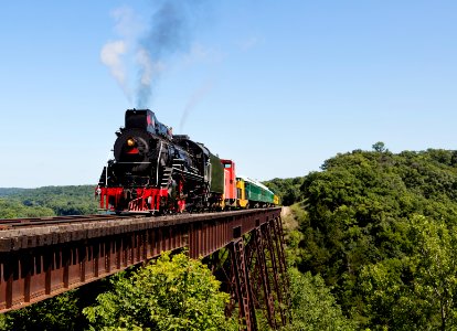 A steam train on a heritage railroad that operates excursions in Boone County, Iowa, crosses the 156-foot-tall Bass Point Creek Bridge. Original image from Carol M. Highsmith’s America, Library of Congress collection.