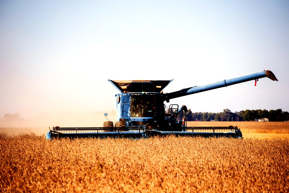 A harvesting operation kicks up dust in rural Carroll County, Indiana. Original image from Carol M. Highsmith’s America, Library of Congress collection.