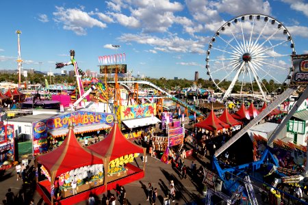 Carnival rides and games, including a Ferris wheel, in Phoenix at the annual Arizona State Fair, which has been held since 1884, eighteen years before statehood, when it was a territorial fair. Original image from Carol M. Highsmith’s America, Library of Congress collection.