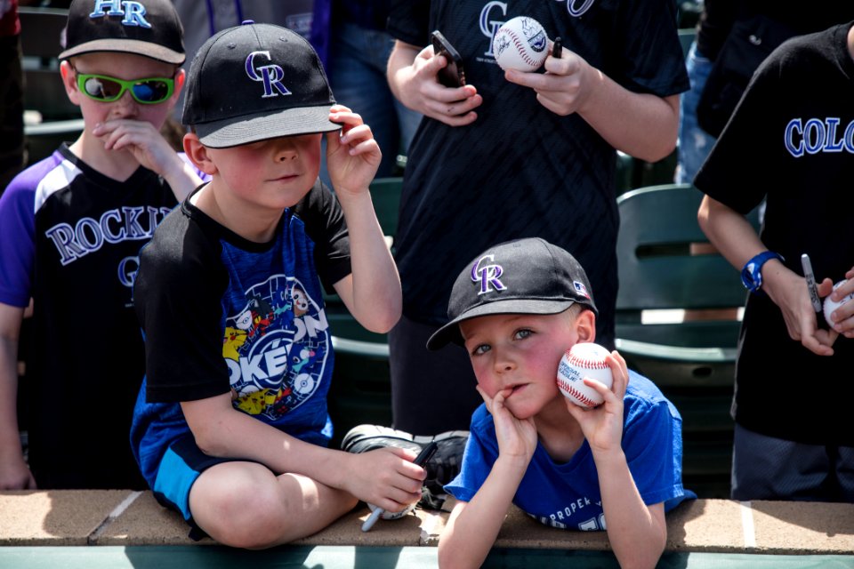 Young fans of the Colorado Rockies major-league baseball team wait and hope for player autographs at a Spring Training game between the Rockies and the Arizona Diamondbacks in Scottsdale, Arizona. Original image from Carol M. Highsmith’s America, Library of Congress collection.
