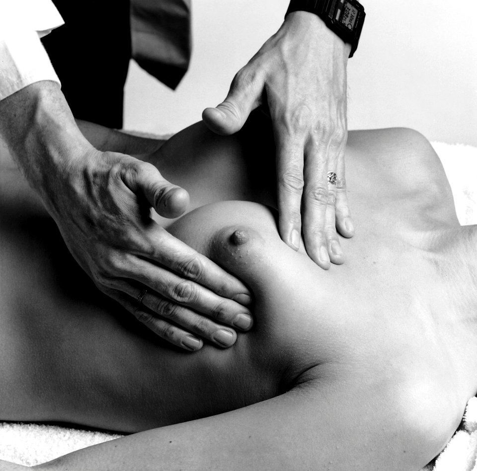 Naked woman showing her breasts. Breast Exam (1985).