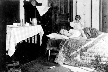 Red Cross Home Service arriving just in time to rescue this woman from the clutches of influenza (1918). photo