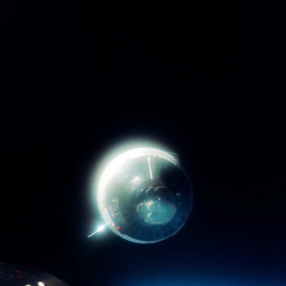 The Earth-orbiting Gemini-6 spacecraft against the blackness of space.