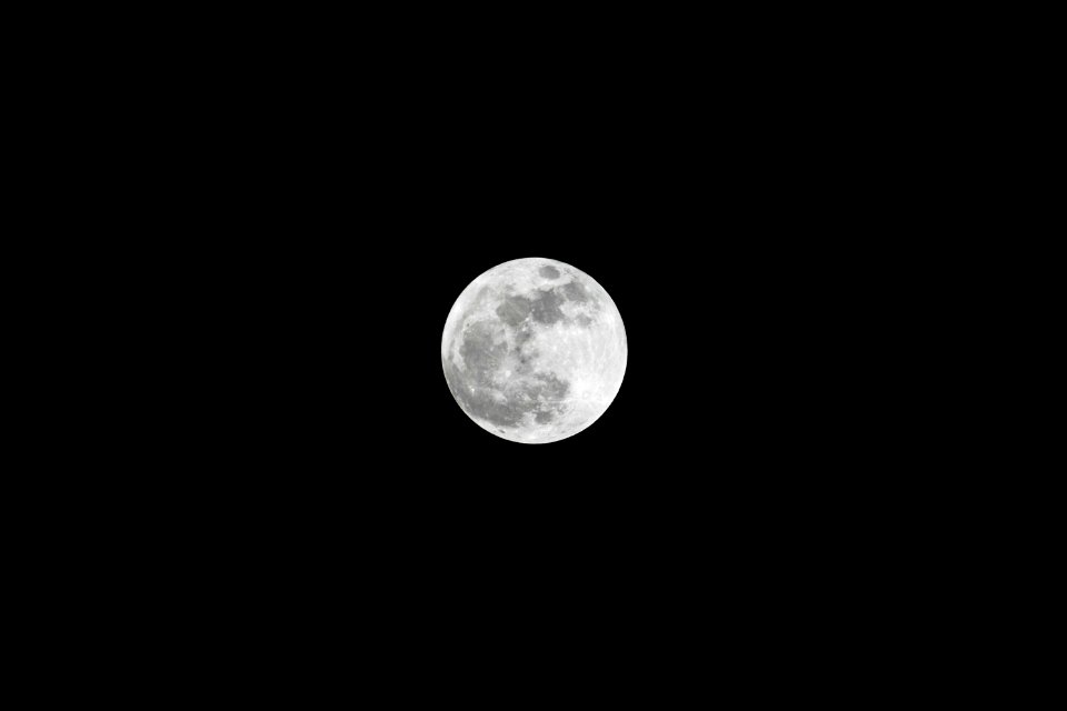 View of the super moon in the eastern sky over Kennedy Space Center in Florida.