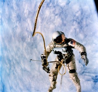 Astronaut Edward H. White II, pilot for the Gemini-Titan 4 (GT-4) spaceflight, floats in the zero-gravity of space during the third revolution of the GT-4 spacecraft. photo