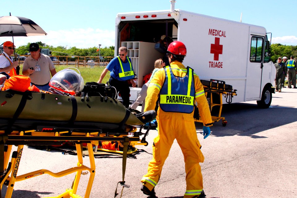 Volunteers portraying astronauts are transported to ambulances as part of a Mode II-IV evacuation simulation exercise at NASA Kennedy Space Center's Launch Pad 39A, which conducted by The Space Shuttle Program and U.S. Air Force.