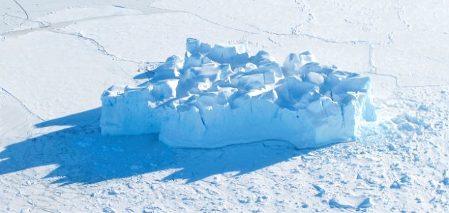 An iceberg embedded in sea ice as seen from the IceBridge DC-8 over the Bellingshausen Sea on Oct. 19, 2012. photo