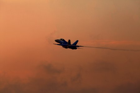 A pathfinder aircraft soars high through the air. photo