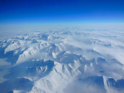 Alaskan mountains seen from high altitude. photo
