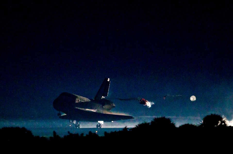 The drag chute is deployed as the space shuttle Atlantis lands on July 21, 2011 at the Kennedy Space Center in Florida.