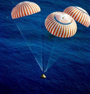 The Apollo 17 Command Module (CM), with astronauts Eugene A. Cernan, Ronald E. Evans and Harrison H. Schmitt aboard, nears splashdown in the South Pacific Ocean. photo