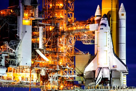 At NASA's Kennedy Space Center in Florida, the STS-133 payload canister is lifted into the rotating service structure on Launch Pad 39A. The payload then will be moved into space shuttle Discovery's payload bay. photo