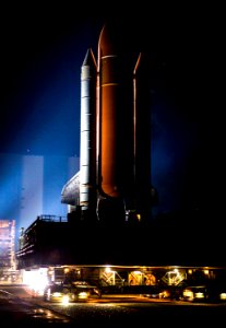 Xenon lights illuminate space shuttle Discovery as it makes its nighttime trek, known as rollout, from the Vehicle Assembly Building to Launch Pad 39A at NASA's Kennedy Space Center in Florida.