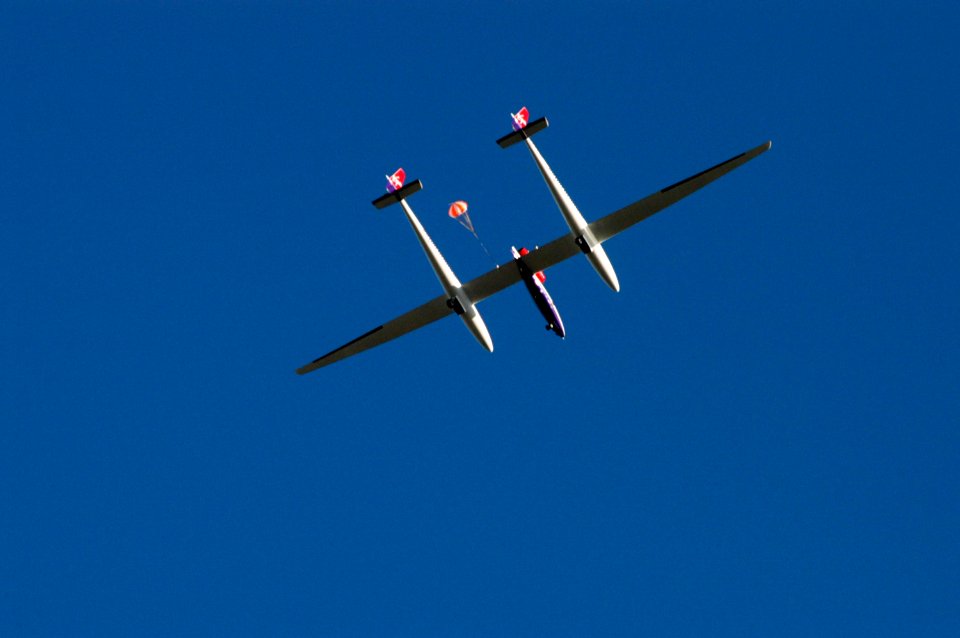 The Virgin Atlantic Airways GlobalFlyer aircraft sails across the sky near NASA Kennedy Space Center’s Shuttle Landing Facility.