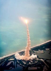 Space shuttle Atlantis is seen through the window of a Shuttle Training Aircraft (STA) as it launches from launch pad 39A at Kennedy Space Center on the STS-135 mission, Friday, July 8, 2011 in Cape Canaveral, Fla. Digitally enhanced by rawpixel photo
