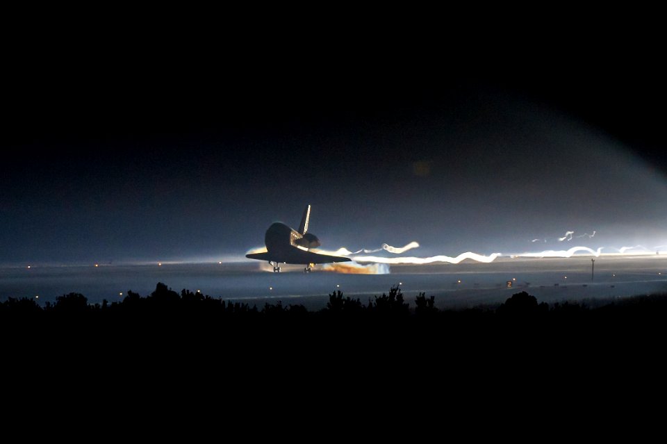 Space shuttle Atlantis touches down at NASA's Kennedy Space Center Shuttle Landing Facility completing its 13-day mission to the International Space Station and the final flight of the Space Shuttle Program, July 21, 2011, in Cape Canaveral, Fla.