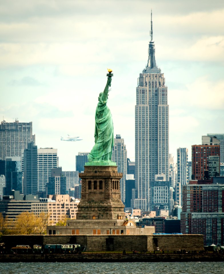Space shuttle Enterprise, mounted atop a NASA 747 Shuttle Carrier Aircraft seen behind the Statue of Liberty, Friday, April 27, 2012, in New York.