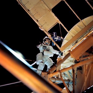 Astronaut Owen K. Garriott, Skylab 3 science pilot, retrieves an imagery experiment from the Apollo Telescope Mount (ATM) attached to the Skylab in Earth orbit.