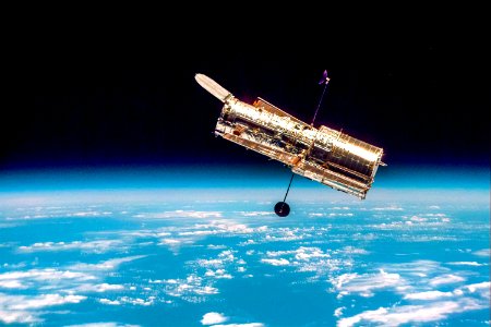 The Hubble Space Telescope hovers at the boundary of Earth and space. photo