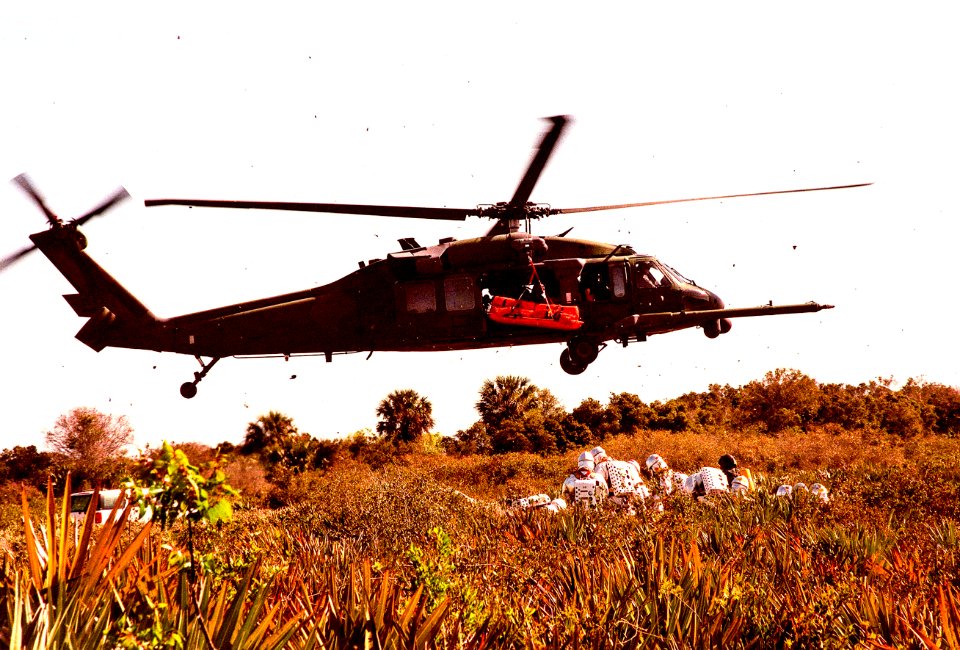 The KSC response team practices lifting an injured crew member to an Air Force HH-60 helicopter for transport to a local hospital.