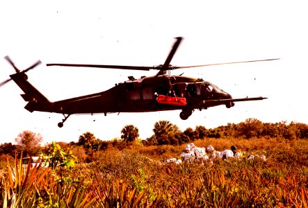 The KSC response team practices lifting an injured crew member to an Air Force HH-60 helicopter for transport to a local hospital.