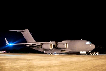 NASA's Mars Science Laboratory (MSL) rover, known as Curiosity, arrives at the Shuttle Landing Facility at NASA's Kennedy Space Center in Florida aboard an Air Force C-17 cargo plane. photo