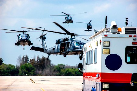 Helicopters with medical personnel arrive at the Shuttle Landing Facility at NASA's Kennedy Space Center in Florida before space shuttle Discovery's landing.